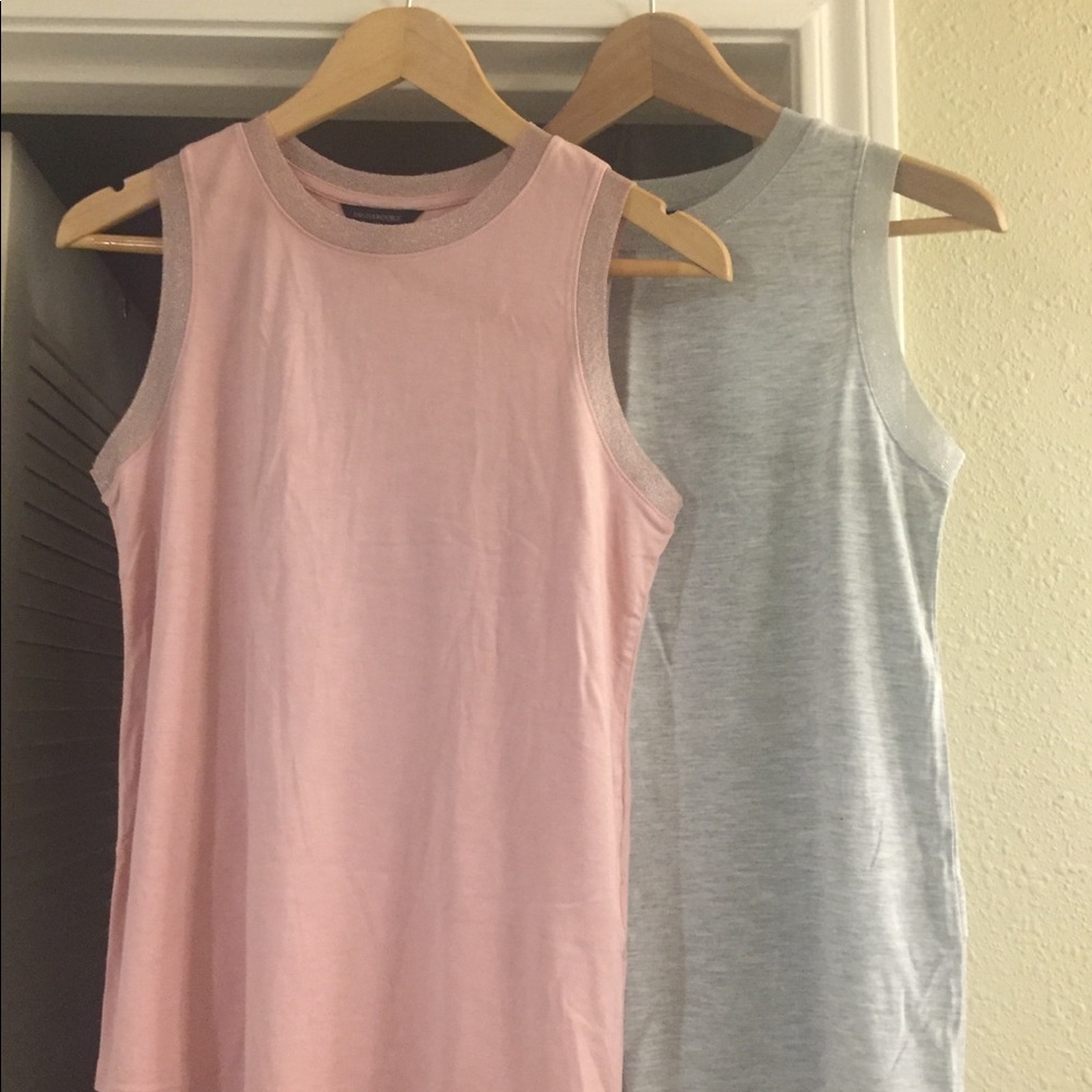 2 sleeveless shirts